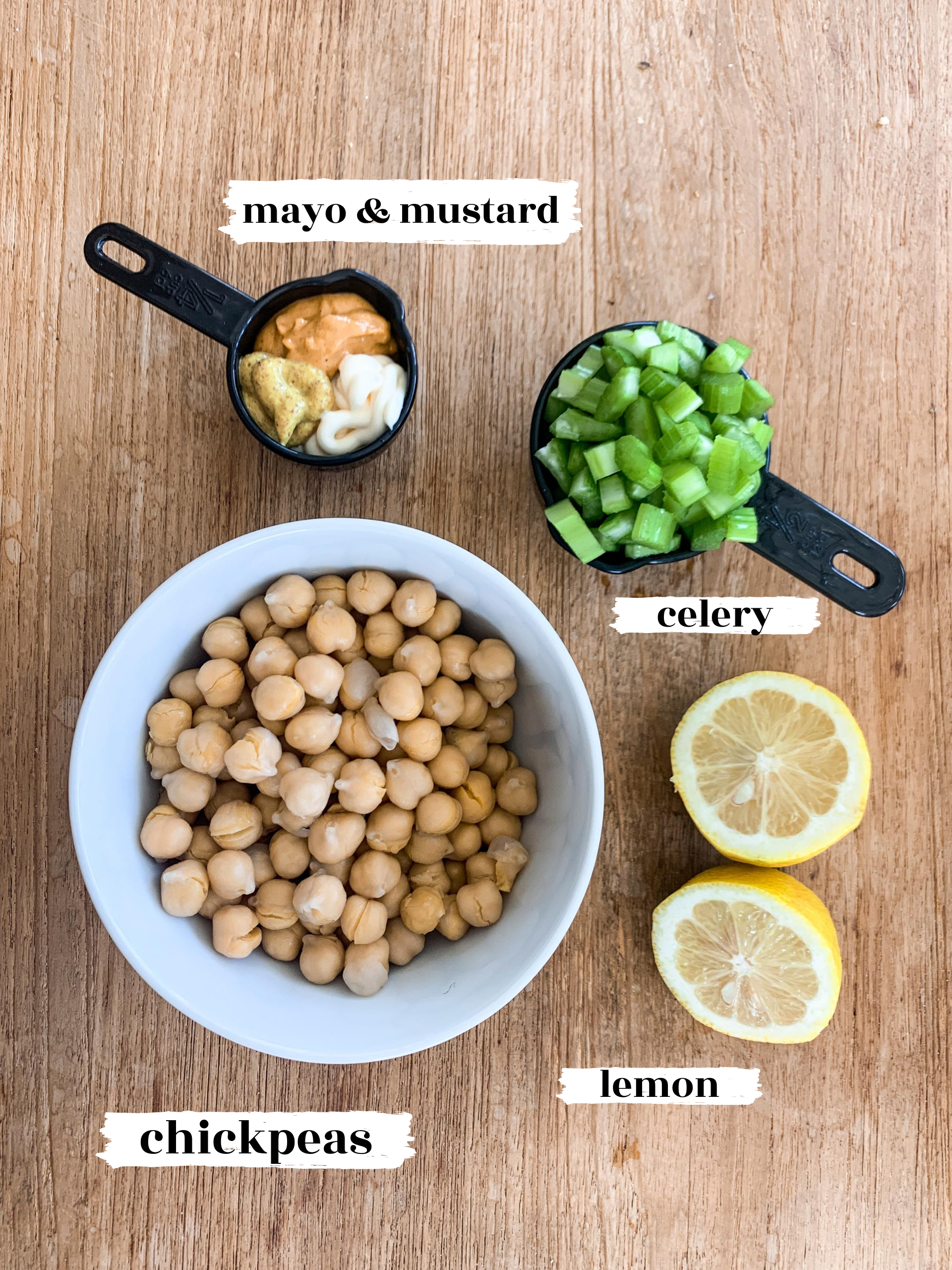 chickpea salad ingredients with text on light wood background