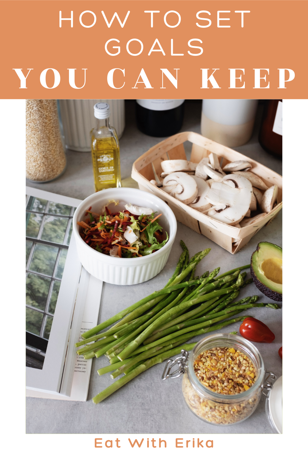 kitchen counter with asparagus, mushrooms, olive oil and cookbook, how to set goals you can keep