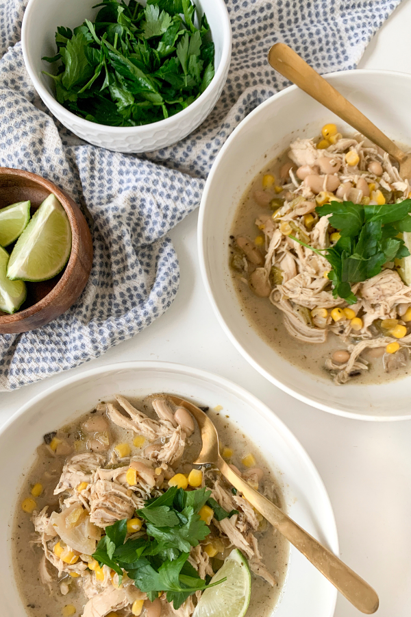 white chicken chili bows topped with lime and parsley